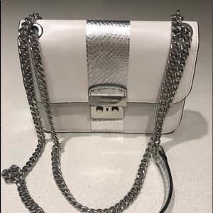 Michael Kors white and silver cross-body purse.